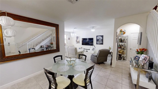 4231 SW 165th Ct, Miami, FL 33185 - dining space with light tile patterned floors and arched walkways