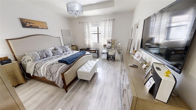 4231 SW 165th Ct, Miami, FL 33185 - bedroom featuring light wood-type flooring and a tray ceiling