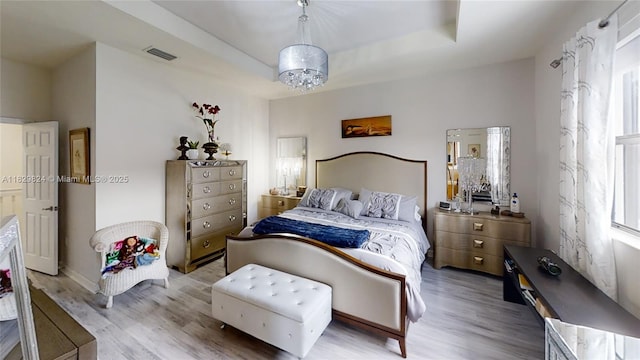 4231 SW 165th Ct, Miami, FL 33185 - bedroom featuring wood finished floors, multiple windows, and a tray ceiling