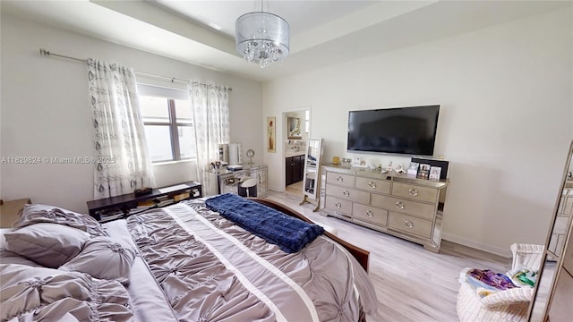4231 SW 165th Ct, Miami, FL 33185 - bedroom featuring light wood-style flooring, a chandelier, and ensuite bath
