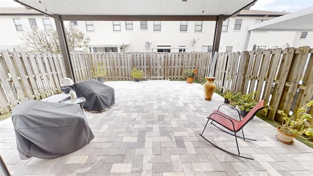 4231 SW 165th Ct, Miami, FL 33185 - fenced backyard featuring area for grilling, a patio, and ceiling fan