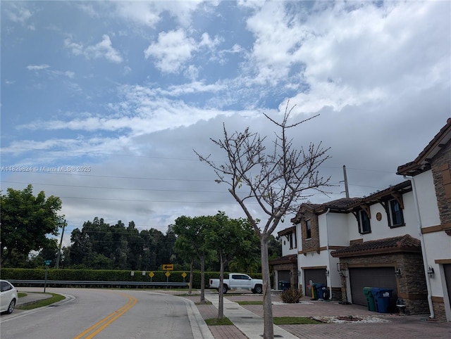 4231 SW 165th Ct, Miami, FL 33185 - view of asphalt street with sidewalks and curbs
