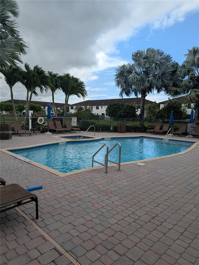 4231 SW 165th Ct, Miami, FL 33185 - community pool with a patio area