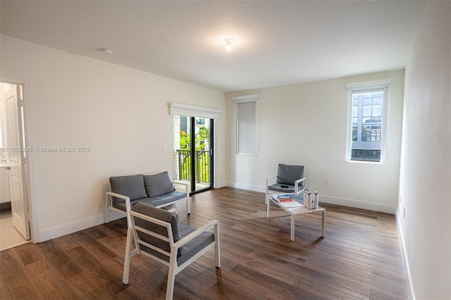4269 NW 83rd Path, Doral, FL 33166 - living area featuring healthy amount of natural light and wood finished floors