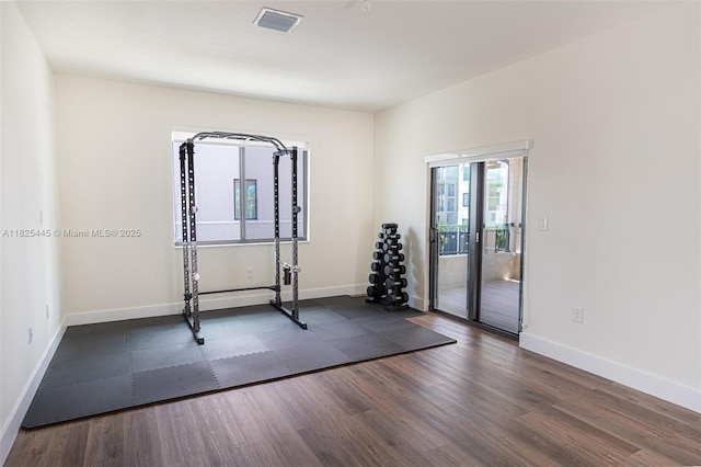 4269 NW 83rd Path, Doral, FL 33166 - workout room featuring dark wood finished floors and baseboards