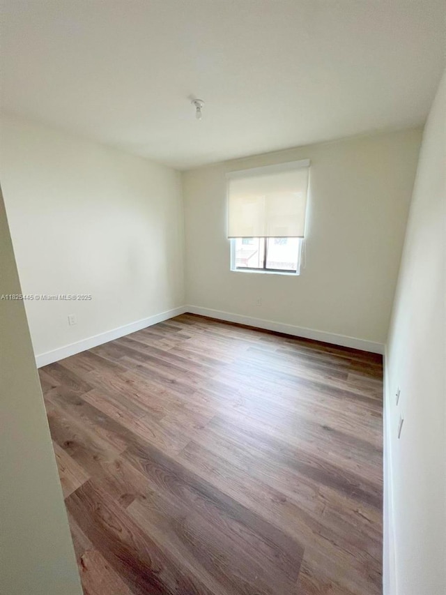 4269 NW 83rd Path, Doral, FL 33166 - spare room with wood finished floors and baseboards
