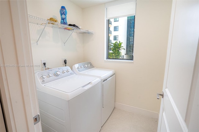 4269 NW 83rd Path, Doral, FL 33166 - laundry room with washer and dryer and light tile patterned floors