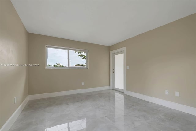 9241 SW 204th Ter, Cutler Bay, FL 33189 - spare room with baseboards and light marble finish flooring