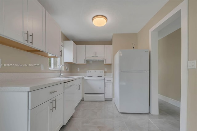 9241 SW 204th Ter, Cutler Bay, FL 33189 - kitchen featuring white appliances, under cabinet range hood, light countertops, and white cabinetry