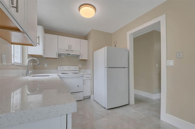9241 SW 204th Ter, Cutler Bay, FL 33189 - kitchen with white appliances, under cabinet range hood, white cabinetry, and light stone countertops