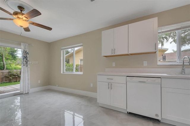 9241 SW 204th Ter, Cutler Bay, FL 33189 - kitchen featuring dishwasher, light countertops, white cabinetry, and a ceiling fan