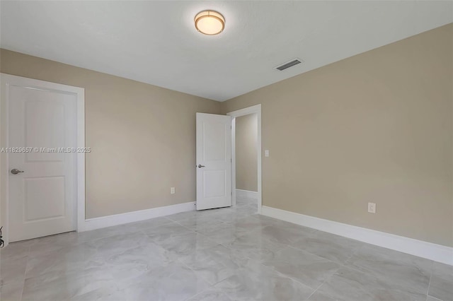 9241 SW 204th Ter, Cutler Bay, FL 33189 - unfurnished bedroom featuring baseboards and light marble finish flooring