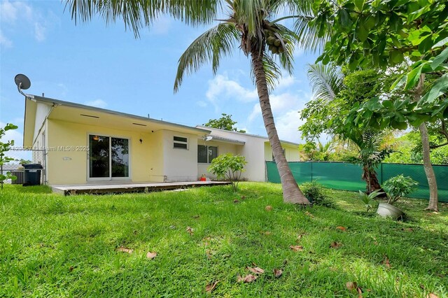 9241 SW 204th Ter, Cutler Bay, FL 33189 - back of house featuring stucco siding
