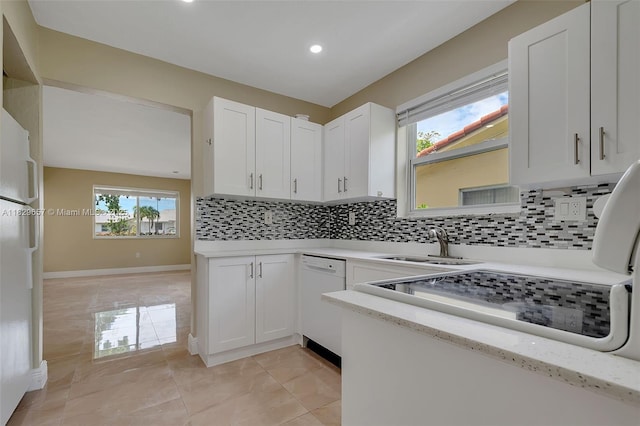 9241 SW 204th Ter, Cutler Bay, FL 33189 - kitchen featuring dishwasher, backsplash, white cabinets, recessed lighting, and light stone countertops