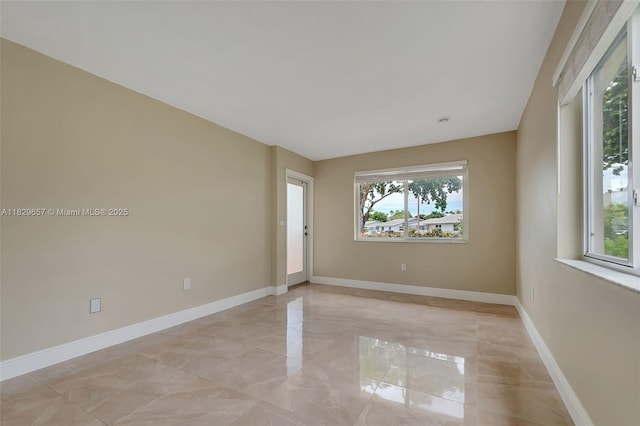9241 SW 204th Ter, Cutler Bay, FL 33189 - unfurnished room featuring light marble finish floors and plenty of natural light