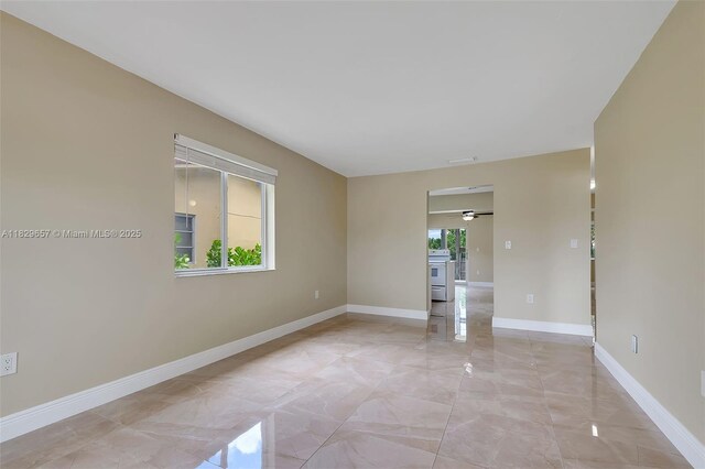9241 SW 204th Ter, Cutler Bay, FL 33189 - spare room with light marble finish flooring and a ceiling fan