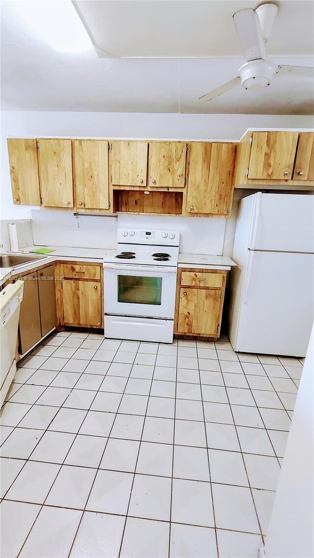 1780 NE 191st St Unit 704-2, Miami, FL 33179 - kitchen featuring white appliances and light countertops