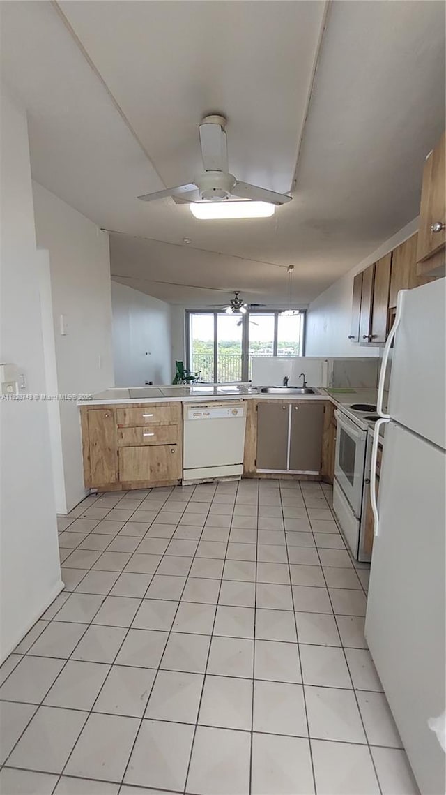 1780 NE 191st St Unit 704-2, Miami, FL 33179 - kitchen with white appliances, light countertops, ceiling fan, and light tile patterned floors