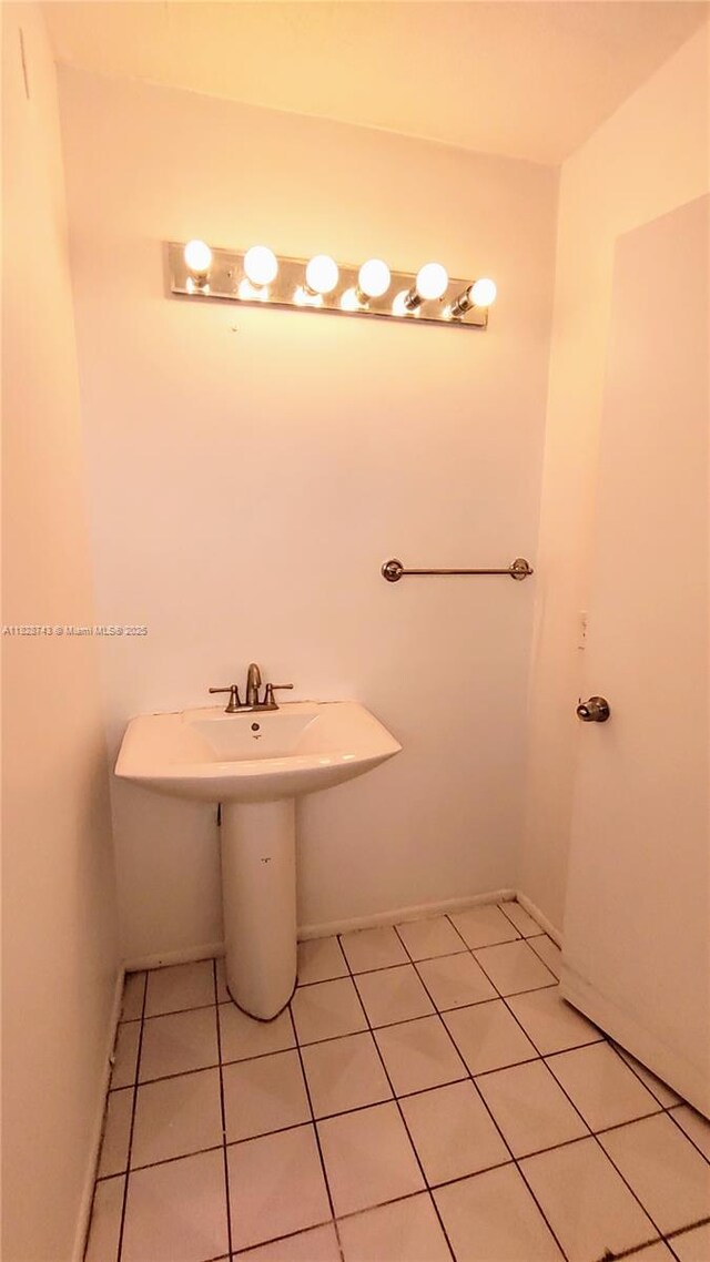 1780 NE 191st St Unit 704-2, Miami, FL 33179 - bathroom featuring tile patterned flooring and a sink
