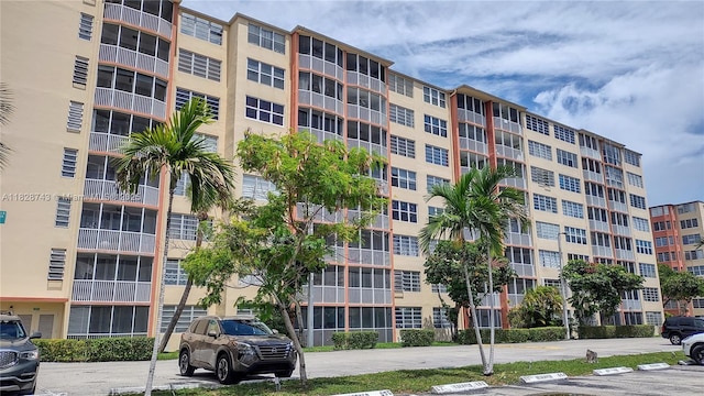 1780 NE 191st St Unit 704-2, Miami, FL 33179 - view of apartment building / complex featuring uncovered parking