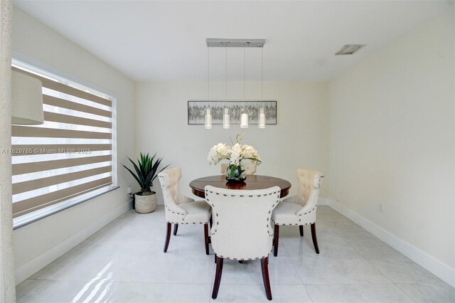 15445 SW 26th Ter, Miami, FL 33185 - dining room featuring baseboards and light tile patterned floors
