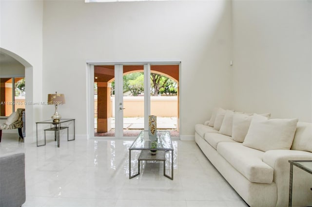 15445 SW 26th Ter, Miami, FL 33185 - living area featuring arched walkways and a towering ceiling
