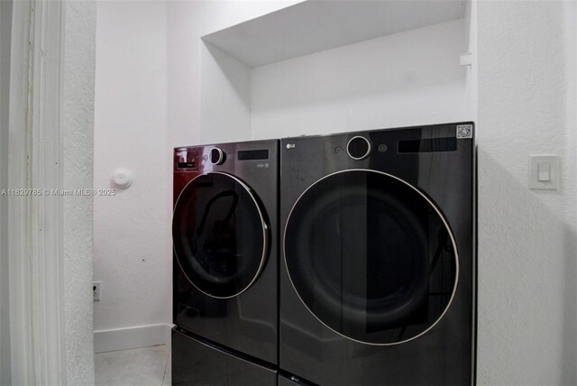 15445 SW 26th Ter, Miami, FL 33185 - laundry area with separate washer and dryer and tile patterned flooring