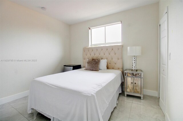 15445 SW 26th Ter, Miami, FL 33185 - bedroom with baseboards and light tile patterned floors