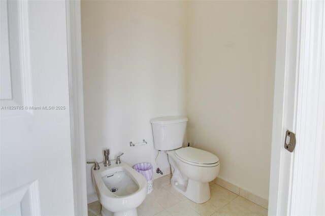 15445 SW 26th Ter, Miami, FL 33185 - bathroom featuring a bidet and tile patterned flooring