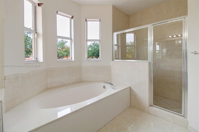 15445 SW 26th Ter, Miami, FL 33185 - full bathroom featuring a garden tub, a shower stall, and tile patterned flooring