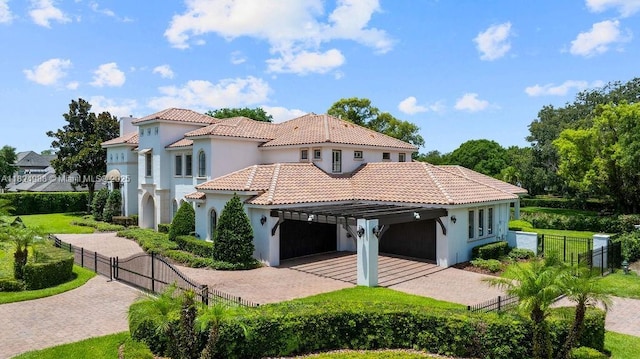 2211 Azalea Pl, Winter Park, FL 32789 - view of front of property with stucco siding, decorative driveway, a gate, and a tiled roof