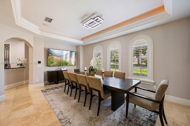 2211 Azalea Pl, Winter Park, FL 32789 - dining area with a tray ceiling and arched walkways