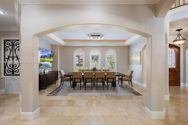 2211 Azalea Pl, Winter Park, FL 32789 - dining room featuring arched walkways, ornamental molding, and a raised ceiling