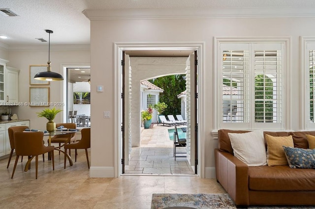 2211 Azalea Pl, Winter Park, FL 32789 - doorway with ornamental molding and a textured ceiling