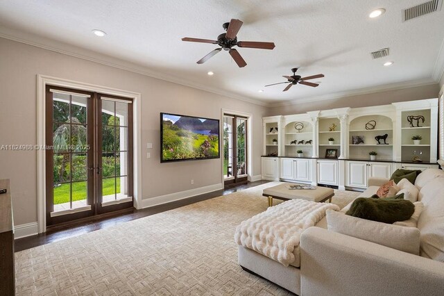 2211 Azalea Pl, Winter Park, FL 32789 - living area featuring wood finished floors, a ceiling fan, crown molding, recessed lighting, and french doors
