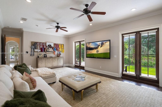 2211 Azalea Pl, Winter Park, FL 32789 - living room with healthy amount of natural light, a ceiling fan, recessed lighting, crown molding, and arched walkways