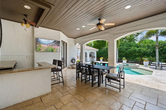 2211 Azalea Pl, Winter Park, FL 32789 - view of patio / terrace featuring a bar, a ceiling fan, an in-ground hot tub, outdoor dining area, and an outdoor pool