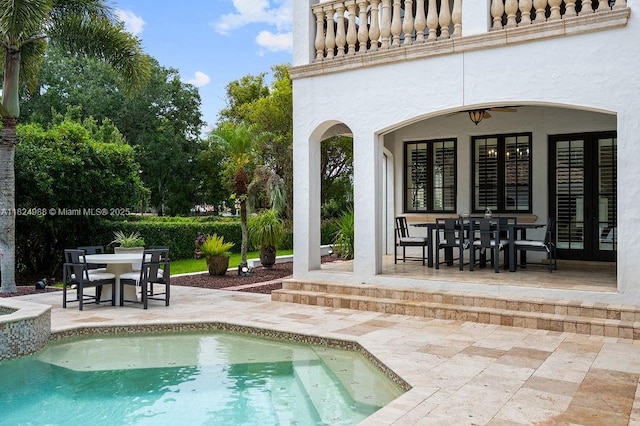 2211 Azalea Pl, Winter Park, FL 32789 - view of swimming pool featuring outdoor dining area, a patio, french doors, ceiling fan, and a pool with connected hot tub