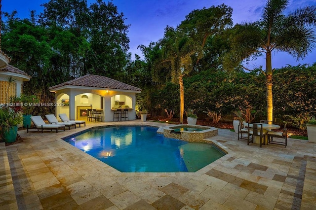 2211 Azalea Pl, Winter Park, FL 32789 - pool at dusk featuring a patio area and a pool with connected hot tub