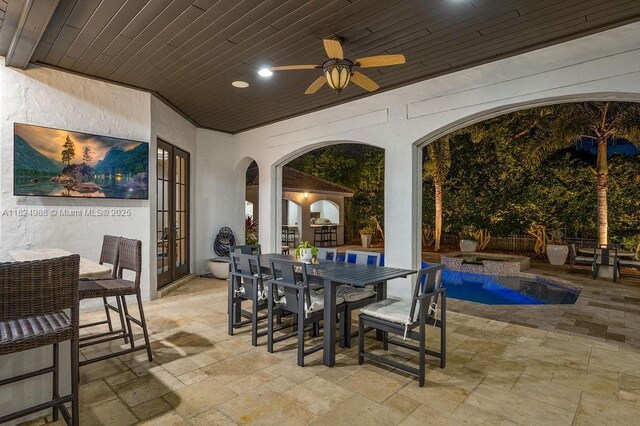 2211 Azalea Pl, Winter Park, FL 32789 - view of patio / terrace featuring outdoor dining space, ceiling fan, a pool with connected hot tub, and french doors