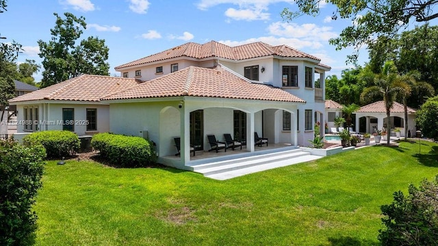 2211 Azalea Pl, Winter Park, FL 32789 - back of property featuring stucco siding, a patio, a tiled roof, a yard, and an outdoor pool