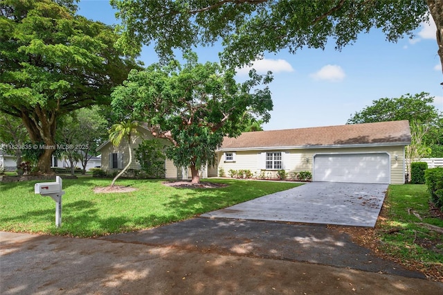 14861 SW 149th St, Miami, FL 33196 - ranch-style house featuring concrete driveway, an attached garage, and a front lawn