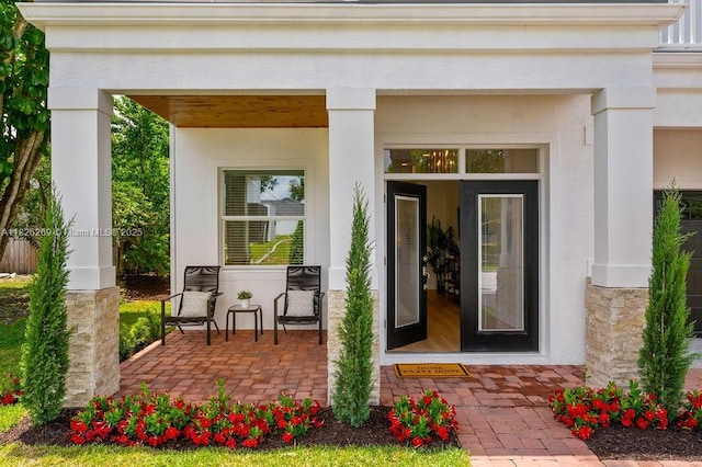 2607 Lafayette Ave, Winter Park, FL 32789 - view of exterior entry with covered porch and stucco siding