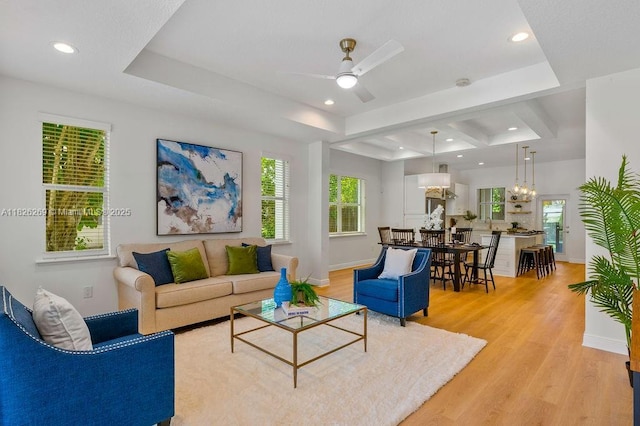 2607 Lafayette Ave, Winter Park, FL 32789 - living area with light wood finished floors, ceiling fan, recessed lighting, a tray ceiling, and a chandelier