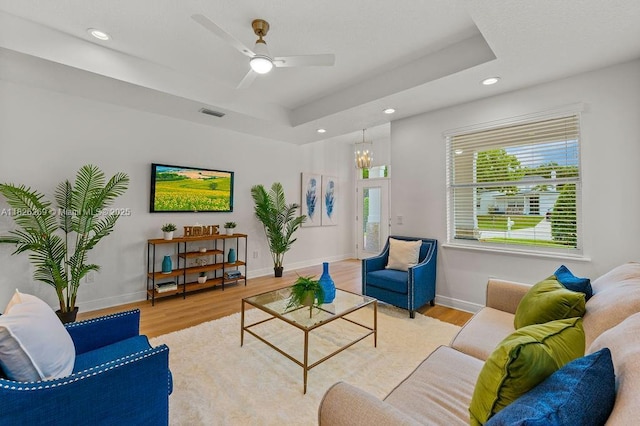 2607 Lafayette Ave, Winter Park, FL 32789 - living area with wood finished floors, recessed lighting, a raised ceiling, a ceiling fan, and a chandelier