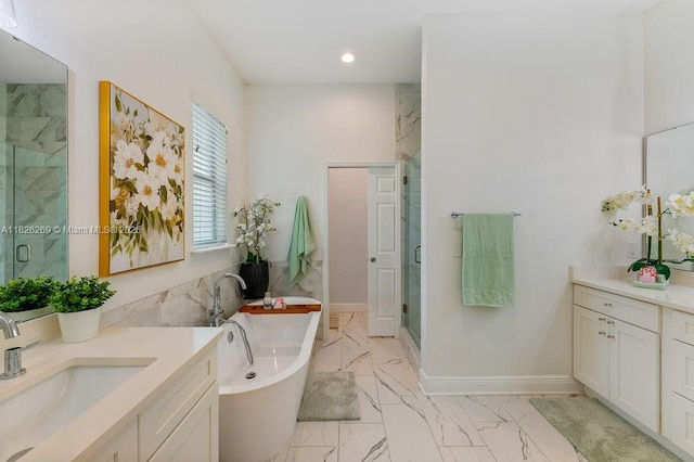 2607 Lafayette Ave, Winter Park, FL 32789 - bathroom featuring marble finish floors, a marble finish shower, vanity, a soaking tub, and recessed lighting