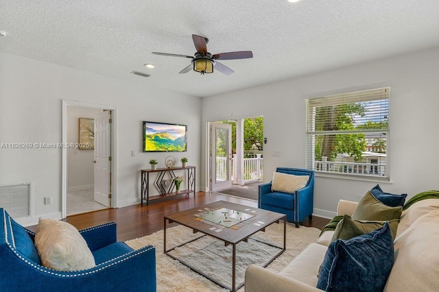 2607 Lafayette Ave, Winter Park, FL 32789 - living room with a ceiling fan, a textured ceiling, and wood finished floors