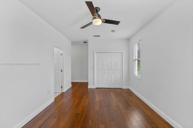 2607 Lafayette Ave, Winter Park, FL 32789 - unfurnished bedroom featuring a closet, dark wood-style floors, and ceiling fan