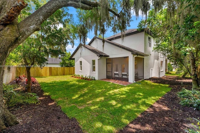 2607 Lafayette Ave, Winter Park, FL 32789 - rear view of house with a sunroom, stucco siding, and french doors