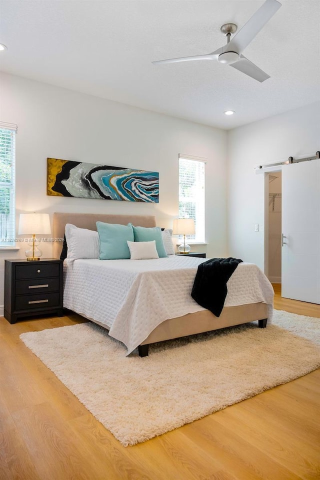 2607 Lafayette Ave, Winter Park, FL 32789 - bedroom featuring multiple windows, light wood-style flooring, recessed lighting, and a ceiling fan